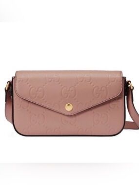 NWOT Embossed Gucci crossbody  in soft pink.